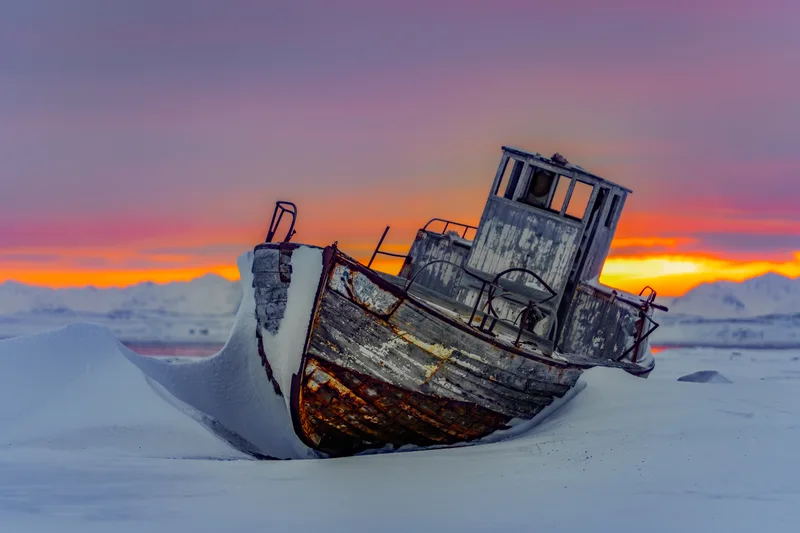 Old shipwreck in the Arctic sunset